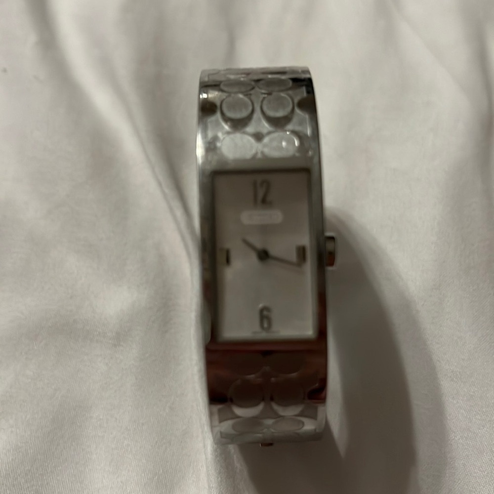 Coach Silver bracelet watch.